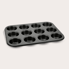 The Zyliss Non-Stick 12 Hole Muffin Pan, made from durable carbon steel and ideal for baking muffins or cupcakes, is displayed on a plain light background.