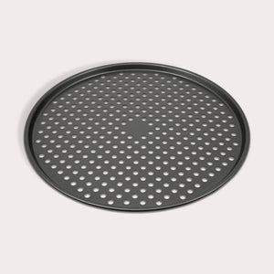 The Zyliss Non-Stick Pizza Tray is a round, black, carbon steel tray featuring numerous evenly spaced holes for crispy pizza bases. Shown on a white background.