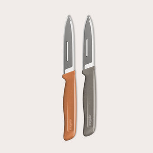 The Zyliss 2 Piece Knife Set features a serrated paring knife with a gray handle and a precision peeling knife with an orange handle, displayed side by side on a light background.