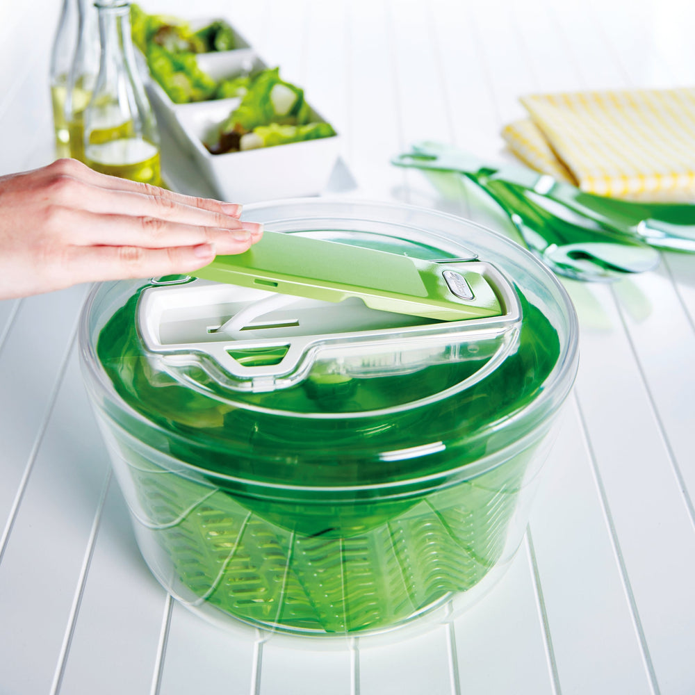 The Zyliss Swift Dry Salad Spinner Large features AquaVent™ technology, a green inner basket, matching green and white lid, and a non-slip base for efficient washing and drying of salad greens. 