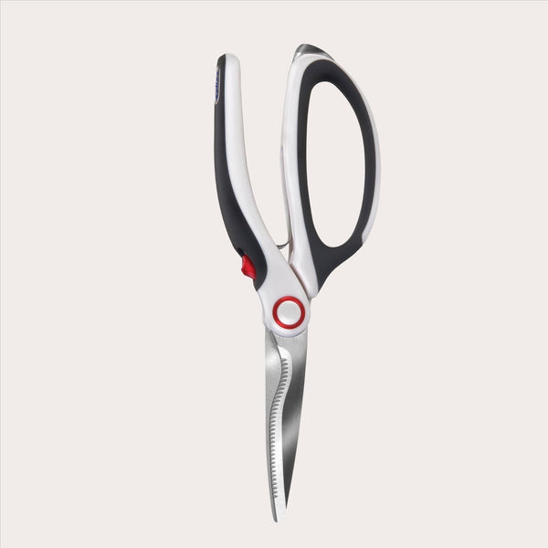 The Zyliss All Purpose Shears, featuring black and white handles and sharp, serrated stainless steel blades, are shown open on a plain white background. 