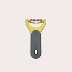 The Zyliss Corn Stripper, featuring a yellow and gray ergonomic handle and wide horizontal stainless steel blade for easy kernel removal, is shown on a plain white background. 