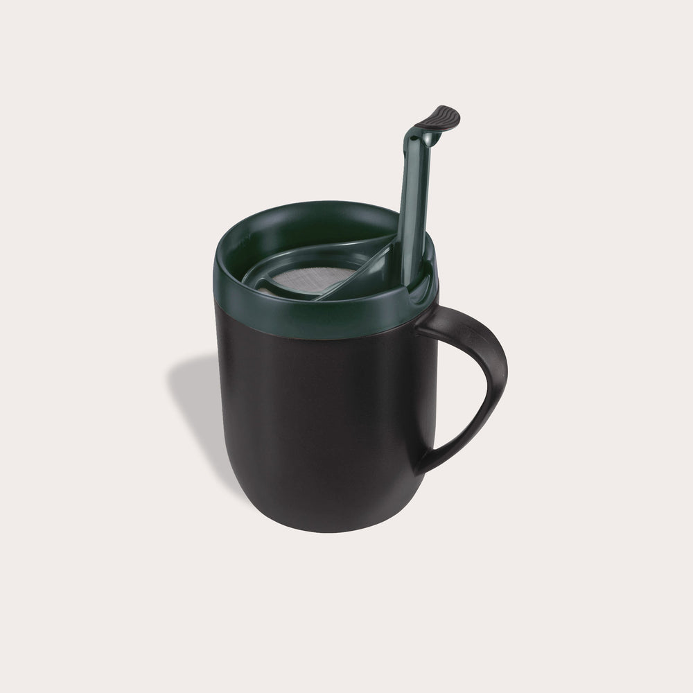 The Zyliss Hot Mug Cafetière Mug in red features a handle, double-wall insulation, dark green lid, and matching green spoon on a light background—ideal for coffee lovers on the move. #red