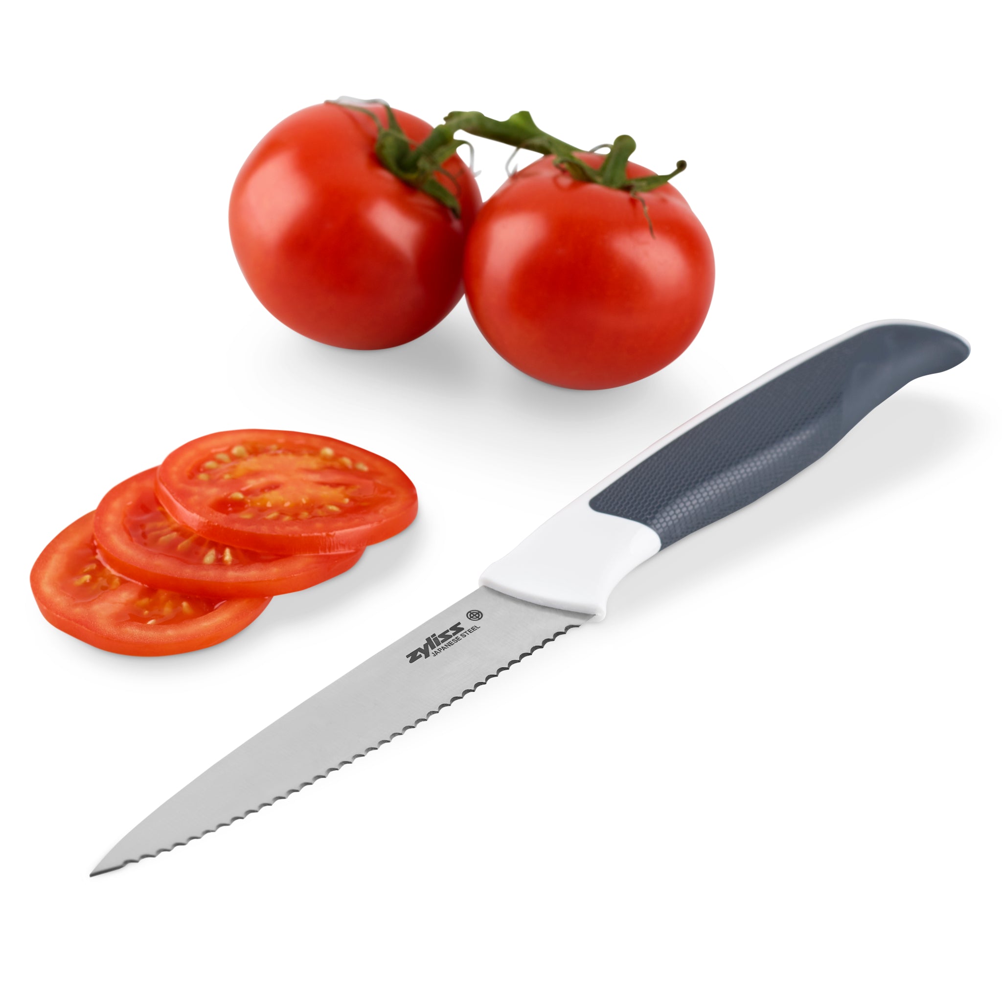 The Zyliss Comfort Serrated Paring Knife 10.5cm with a gray and white handle rests by tomatoes and slices—perfect for precise control when slicing delicate fruits and vegetables—all set on a white background.