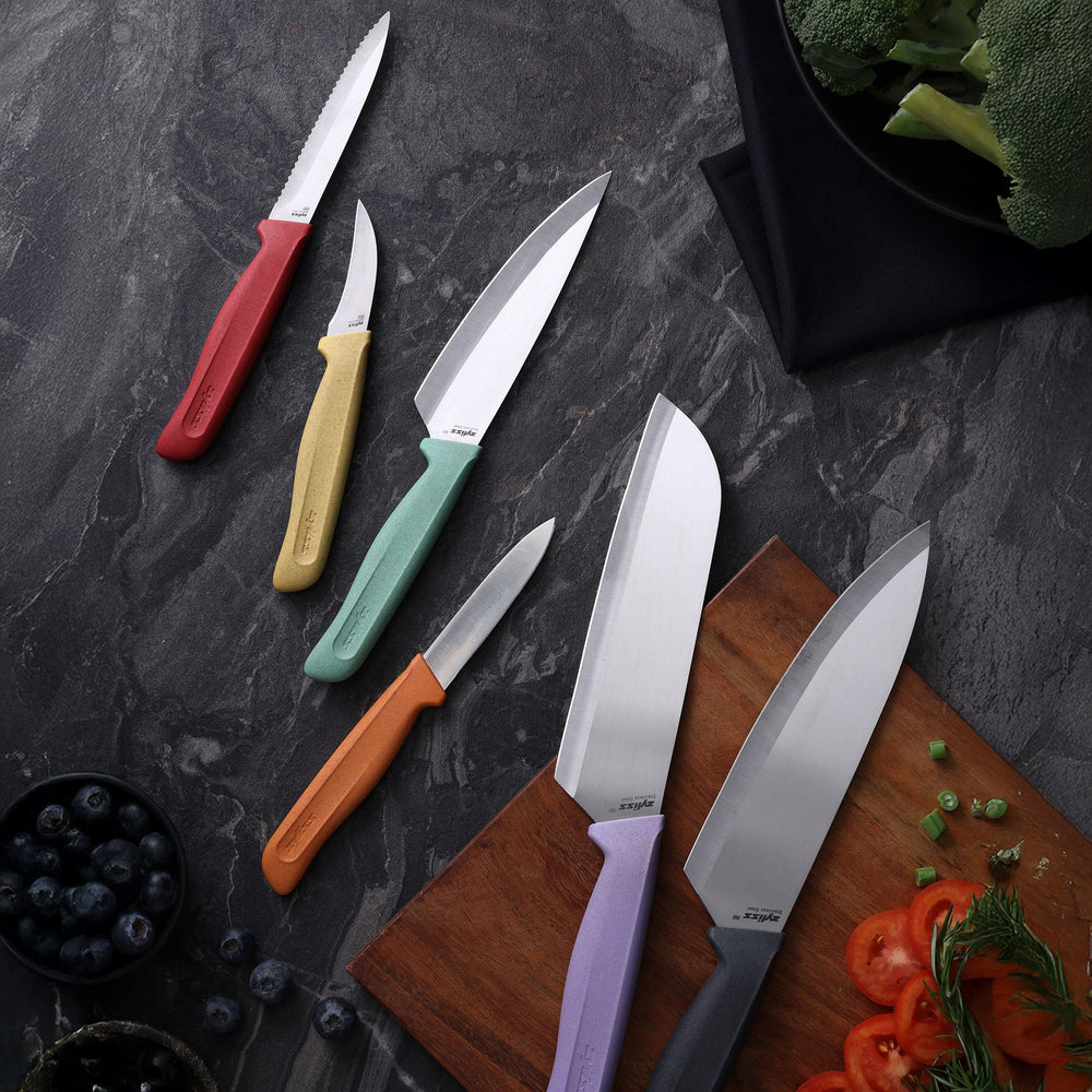 The Zyliss Classic 6-Piece Knife Set features stainless steel blades and vibrant handles in yellow, orange, red, green, purple, and black—arranged by size for a colorful, eye-catching addition to your kitchen.
