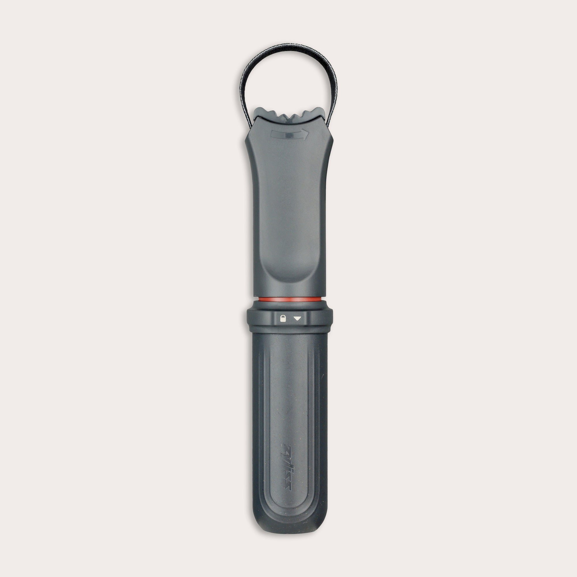 The Zyliss Jar Opener, shown vertically against a light background, is a black and gray handheld tool with a textured grip, integrated locking mechanism, circular top loop, and comes with a protective blade sheath.