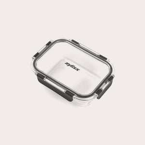 A rectangular glass container branded Zyliss features a clear base, transparent lid, and black locking clips on each side for a secure seal. #0.64L/0.67qt
