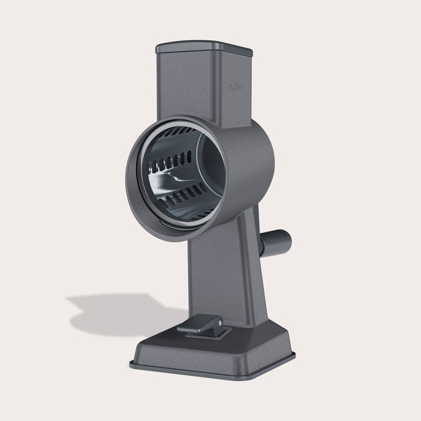 #drumgratersingle #râpeàtamboursimple The Zyliss Gourmet Drum Grater, featuring a sturdy gray stainless steel design with handle and base, stands upright on a light background, highlighting its cylindrical grating drum.