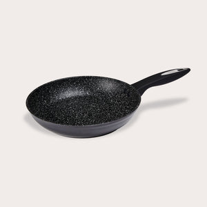 The Zyliss Ultimate Non-Stick Frying Pan features a black scratch-resistant, speckled interior and an ergonomic handle, shown resting on a plain light background. #24cm/9½"