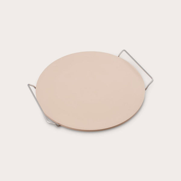 The Zyliss Ceramic Baking Stone, round and beige with a smooth surface, sits on a handled metal rack. This quality accessory is perfect for baking homemade pizza and ensures delicious results every time. 