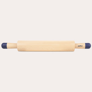 A Zyliss Beech Wood Rolling Pin with blue comfort-grip handles rests horizontally on a light background, showcasing the brand name for an essential tool in any kitchen. 