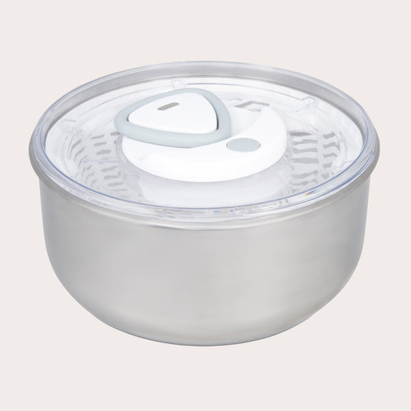 The Zyliss Easy Spin 2 Stainless Steel Salad Spinner features a clear, airtight lid with a white and gray vent, a non-slip base for stability, and a secure lid attachment for easy salad preparation. 