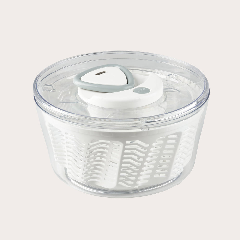 The Zyliss Easy Spin 2 Salad Spinner Large features a green and clear plastic bowl, a white and green lid, and a non-slip base, shown from above against a light background. #Green
