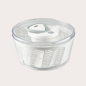 The Zyliss Easy Spin 2 Salad Spinner Large features a clear plastic bowl, white interior basket, gray and white lid, and non-slip base—ideal for washing and drying salad greens with ease. #White