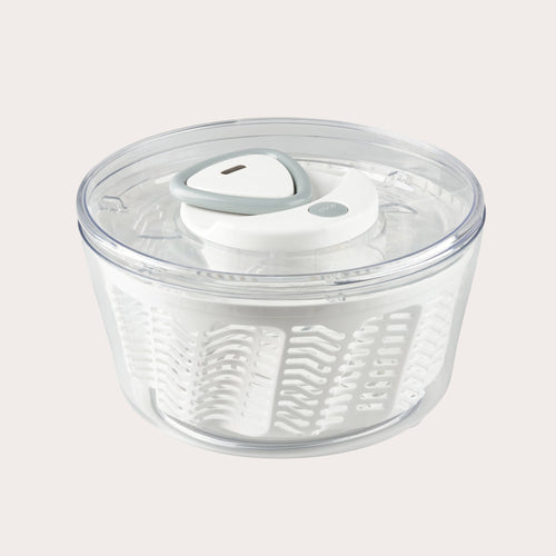 The Zyliss Easy Spin 2 Salad Spinner Large features a clear plastic bowl, white interior basket, gray and white lid, and non-slip base—ideal for washing and drying salad greens with ease. #White