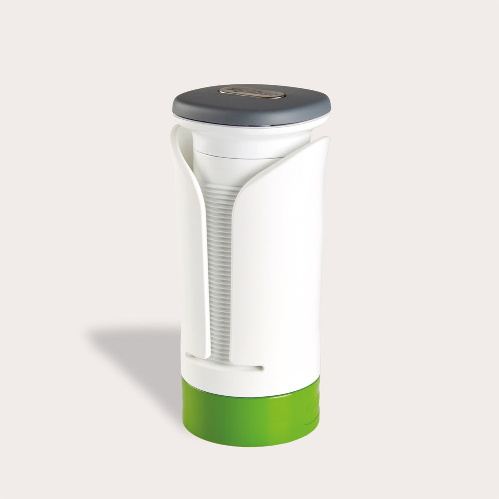 The Zyliss Spiralizer is a white and green plastic, cylindrical tool with a gray top and open front displaying a ridged interior, designed for easy gripping and opening of jars or bottles. 