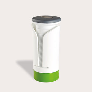 The Zyliss Spiralizer is a white and green plastic, cylindrical tool with a gray top and open front displaying a ridged interior, designed for easy gripping and opening of jars or bottles. 