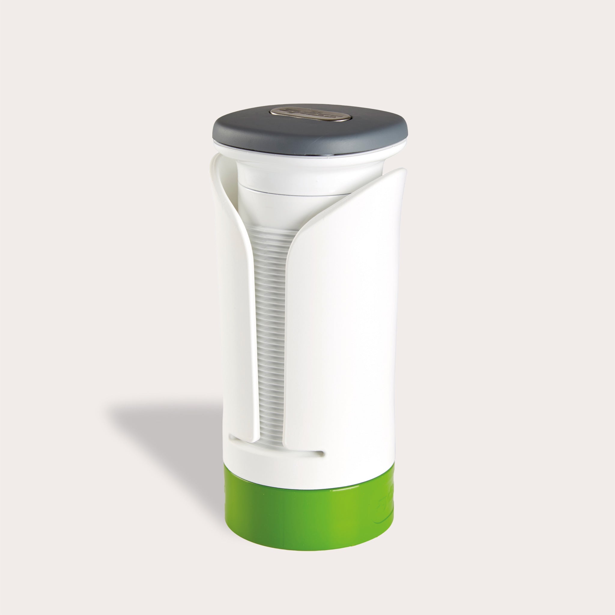 The Zyliss Spiralizer is a white and green plastic, cylindrical tool with a gray top and open front displaying a ridged interior, designed for easy gripping and opening of jars or bottles. 