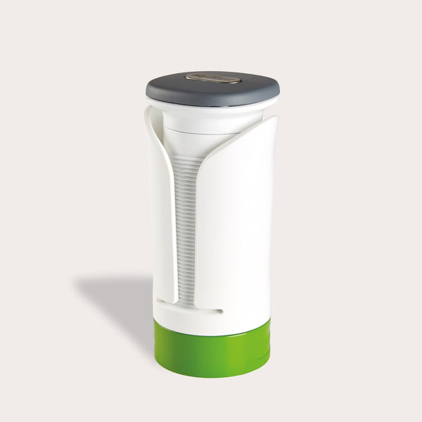The Zyliss Spiralizer is a white and green plastic, cylindrical tool with a gray top and open front displaying a ridged interior, designed for easy gripping and opening of jars or bottles. 