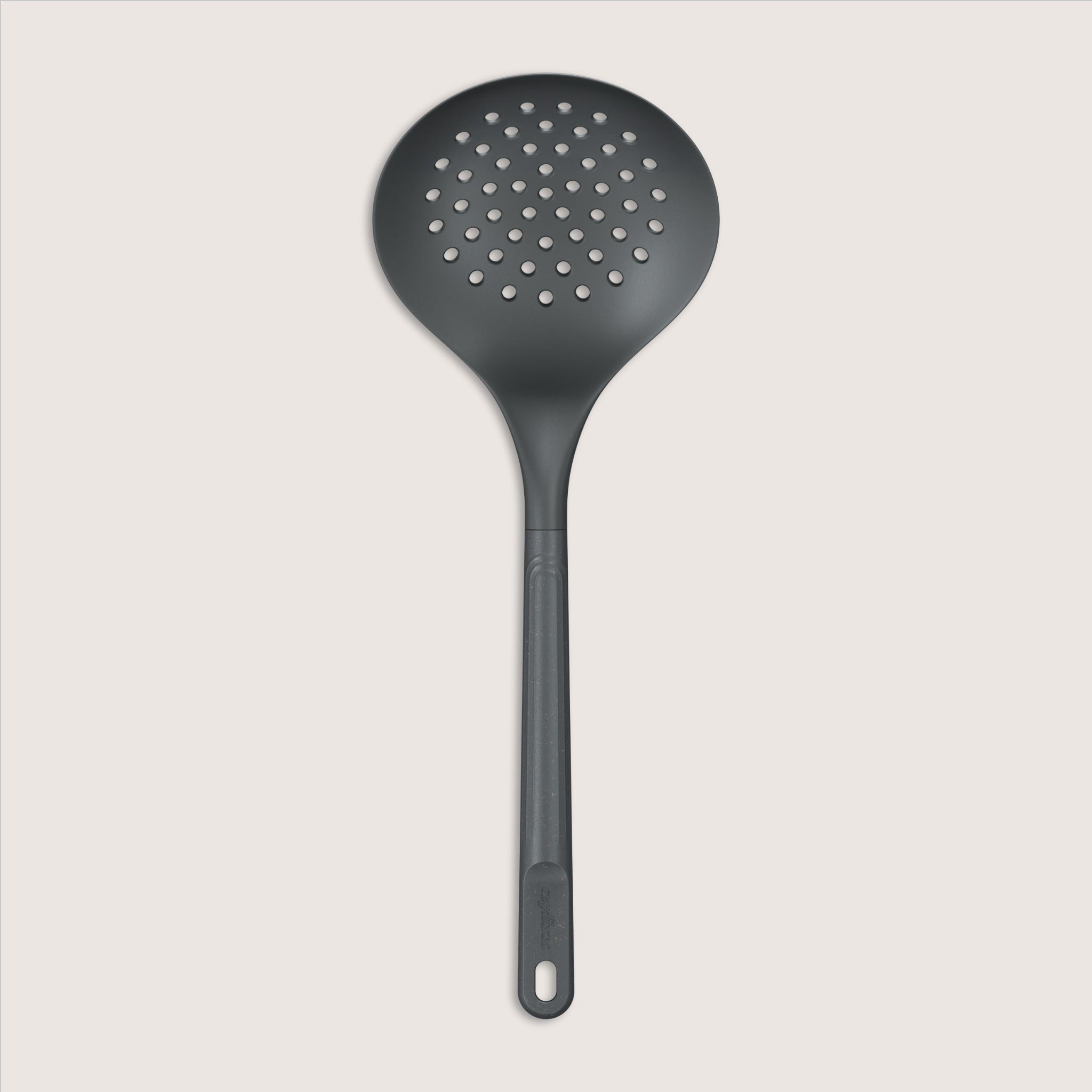 A black slotted spoon with a round, perforated head and a long handle, displayed against a plain light background.