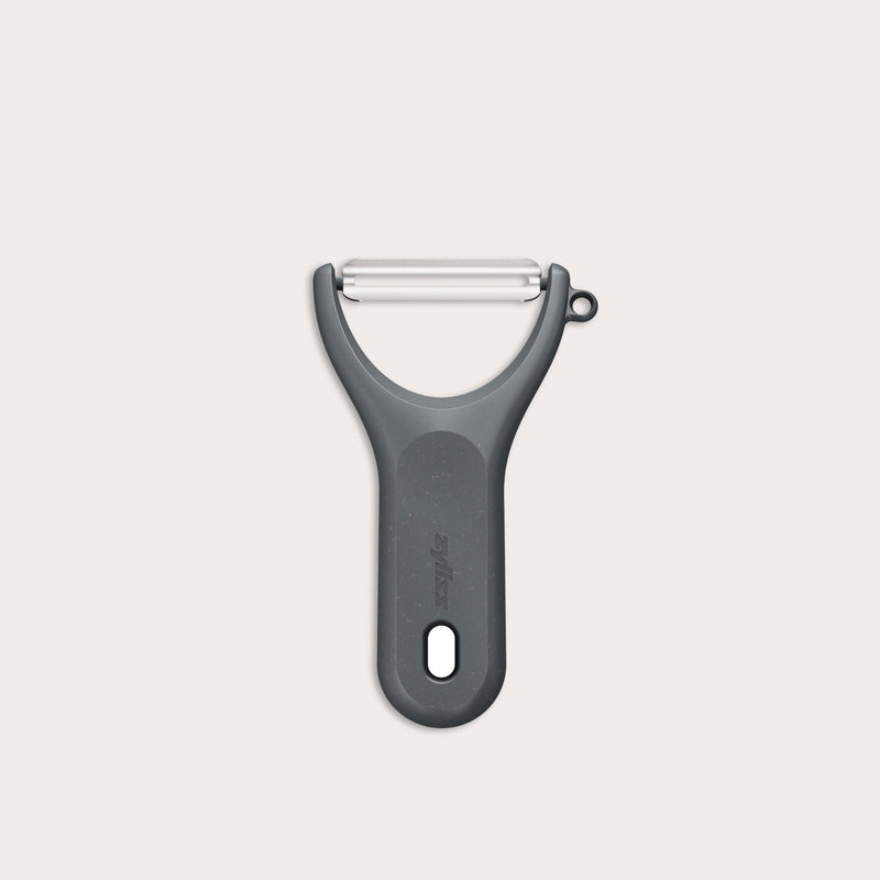 A Zyliss Y Peeler with a stainless steel swivel blade, ergonomic handle, and end hole is shown in black on a plain white background.