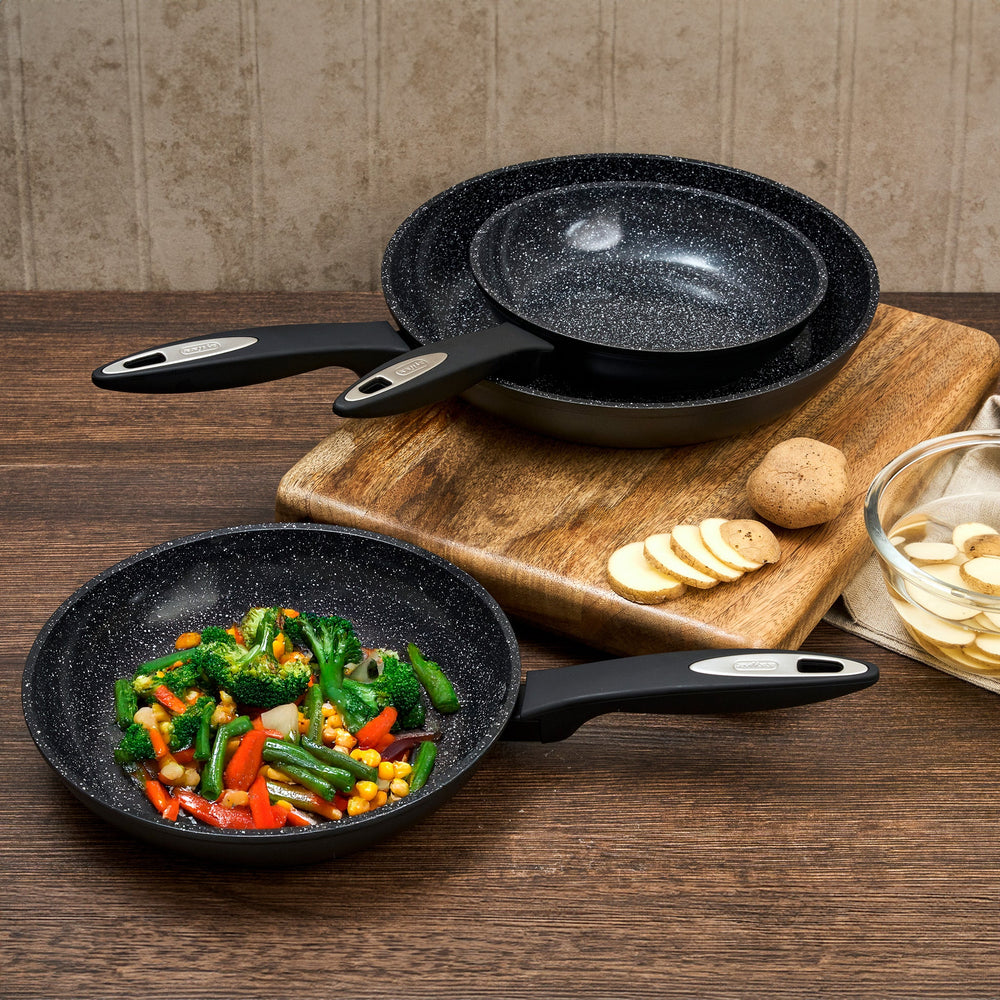 #20cm/8"
The Zyliss Ultimate Ceramic Fry Pan is shown with a black, speckled non-stick interior and long handle on a white background. This PFAS-free cookware is stylish and safe for daily use.