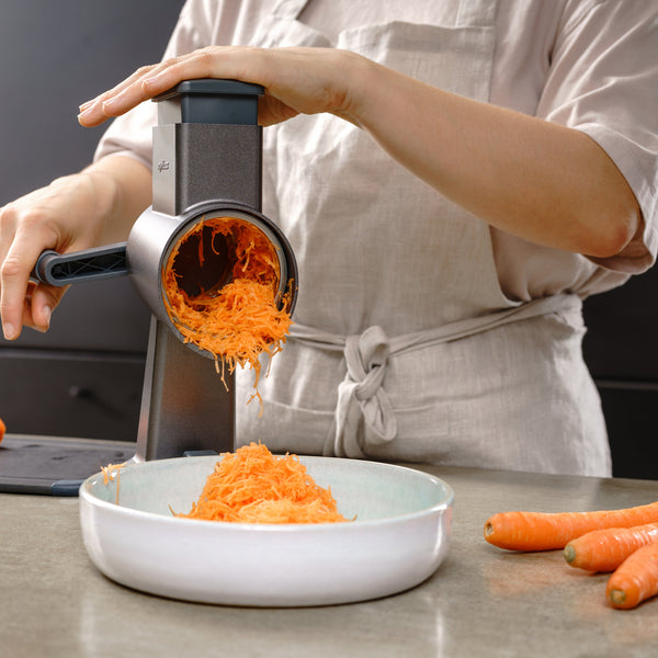 Zyliss Fine Grating Drum Gourmet finely grating ingredients during food preparation.