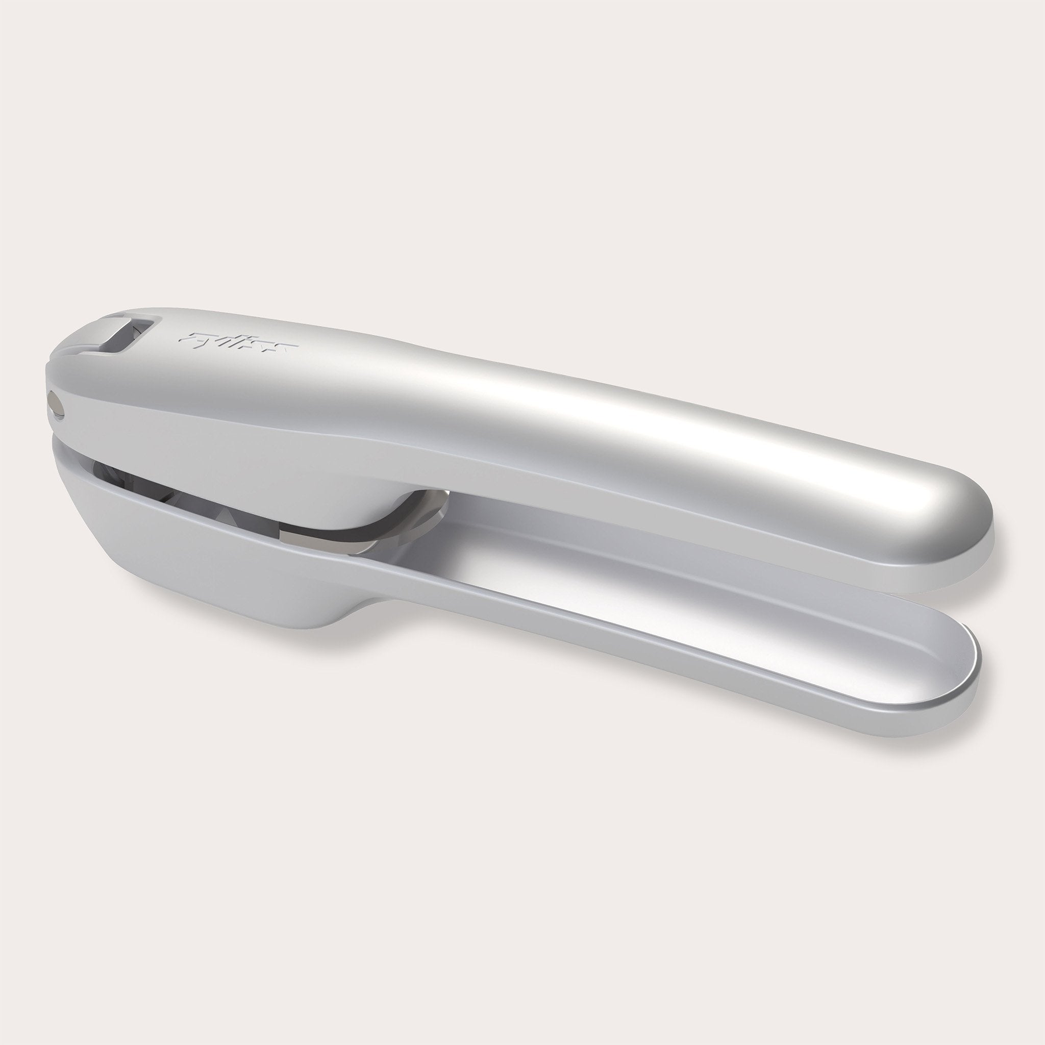 The Zyliss Susi 4 Garlic Press by Zyliss features ergonomic handles and a curved design in silver, shown on a light gray background for easy cleanup.